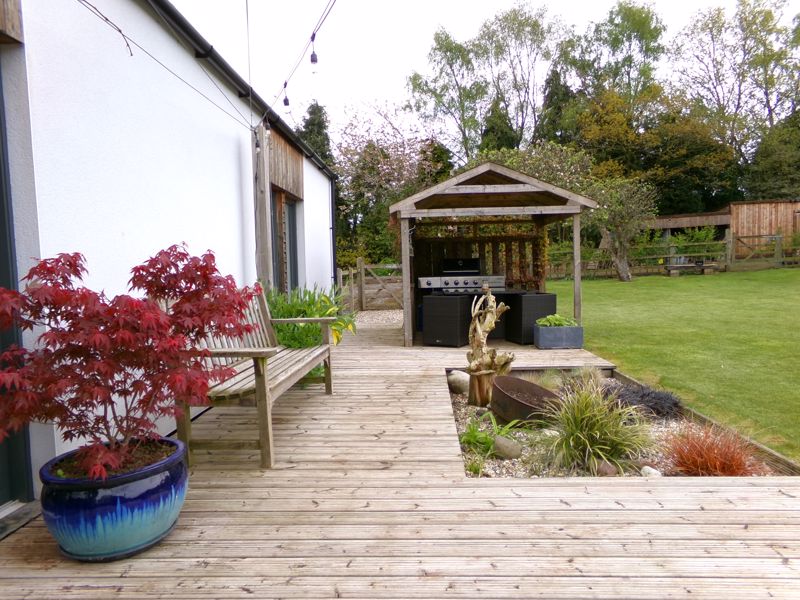 Decked patio & BBQ area- click for photo gallery